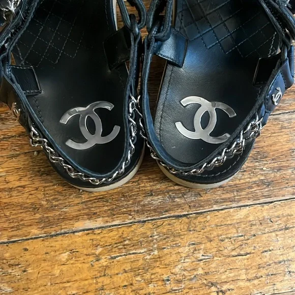 Chanel black leather and silver chain velcro logo sandals. Sandals